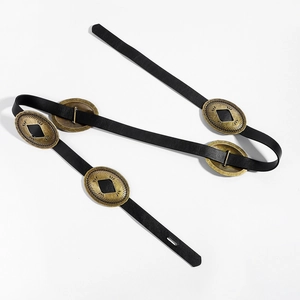 Detail view of black vintage leather belt featuring antique bronze oval metal buckles