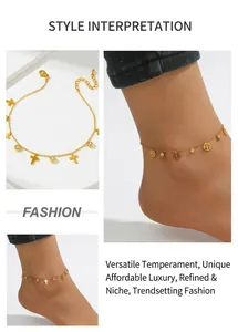 Detail of gold stainless steel anklet with cross pendants and sparkling crystal beads