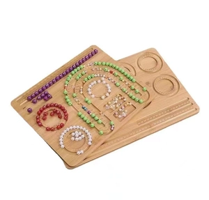 Detailed macro shot of wooden bead design board with carved scale rulers and grooves
