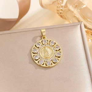 Detail of gold Virgin Mary pendant with colorful cubic zirconia on a jewelry box