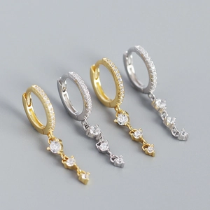 Detailed view of S925 silver hoop earrings with cascading zircon tassels in gold and silver