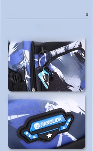Detail of blue camo backpack with rubber brand logo and pixelated sneaker charm