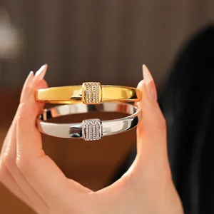 Polished titanium steel bracelets in gold and silver with inlaid square diamond details