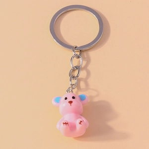 Cute pink resin bear keychain with blue ear accents and silver metal key ring charm