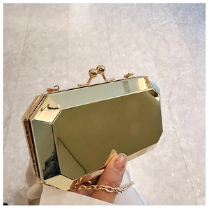 Top view of gold acrylic evening clutch with geometric octagon facets and metal chain