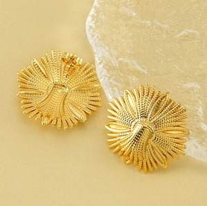 Detailed close-up of gold sunflower stud earrings showing petals and butterfly back closure