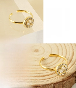 Detail of 18K gold plated stainless steel ring featuring a large round zircon stone