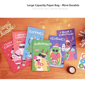 Close-up of colorful Christmas paper gift bags with cartoon Santa and reindeer patterns
