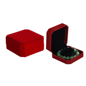 Detail of a red velvet jewelry box for bracelets with a soft black interior lining