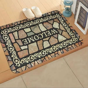 Stone pattern mosaic welcome mat on wooden floor in cozy home entrance setting