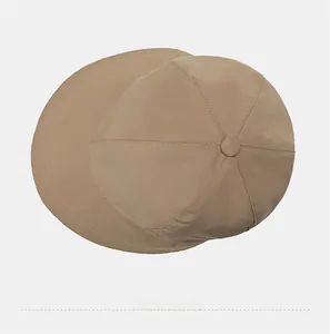 Top view of a beige wide-brim bucket hat showing reinforced stitching and panel structure