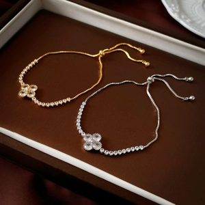 Luxurious gold and silver clover bracelets with cubic zirconia and snake chain straps