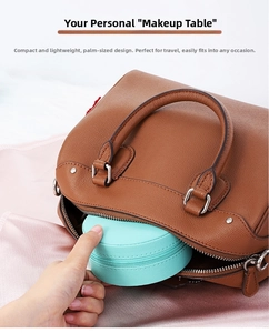 Palm-sized mint green PU leather jewelry case being placed into a handbag for travel
