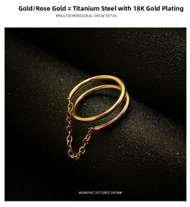 Detail of 18K gold plated titanium double-layer ring with connecting chain link
