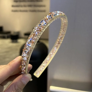 Close-up of sparkling pink and silver diamond rhinestones on a baroque metal headband