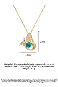 Detailed view of mermaid pendant with blue gemstone and dimensions 1.8cm by 2cm