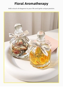 Detailed macro view of faceted glass diffusers with dry flowers and elegant ribbons