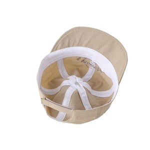 Inside view of baby sun hat with sweatband, reinforced seams and adjustable strap