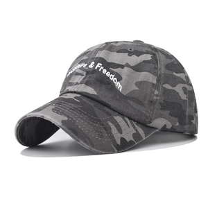 Washed dark grey camouflage baseball cap with white Freedom embroidery on white background