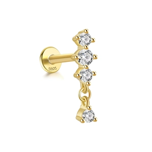 Detailed macro of gold S925 sterling silver earring featuring clear zircon stone settings