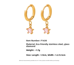 Detail view showing 18K gold plated stainless steel star earrings with pink glass stone