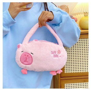 Detail of pink Capybara plush handbag with CAPY BARA embroidery and soft texture