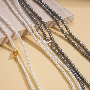 Elegant white and grey pearl necklace set with vintage gold and silver OT buckle design