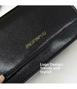 Close-up of black cross-grain leather texture with gold lettering on a shoulder bag