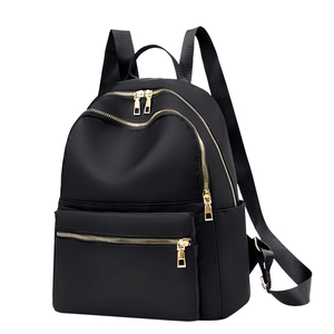 Minimalist black waterproof oxford backpack for women with stylish gold metal zippers