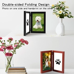Detailed close-up of a double-sided wooden pet memorial frame for photos and paw prints