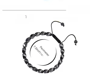 Detail of 8mm hematite beaded bracelet with irregular facets and black woven cord