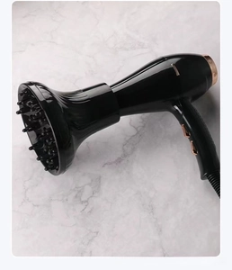 Close-up of professional hair dryer with large diffuser nozzle in black and rose gold