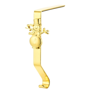 Detailed view of a gold metal Christmas stocking hanger featuring a snowman decoration