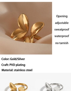 Detailed macro of gold and silver petal-shaped open rings with PVD plated stainless steel
