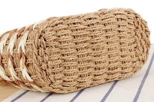 Macro shot of two-tone diagonal weave pattern on a large capacity straw tote bag