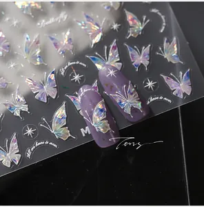 Macro view of holographic butterfly nail stickers with laser metallic fire effect