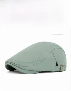 Detail of adjustable bronze buckle on vintage cyan herringbone flat cap side