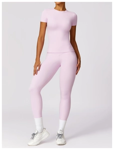 Detail of light purple compression yoga set showing high-waist leggings and slim fit tee