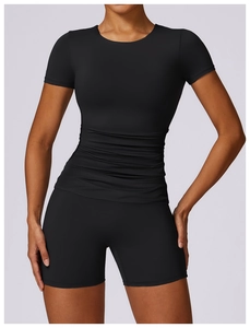 Detailed view of women's black slim-fit yoga t-shirt with stylish ruched front design