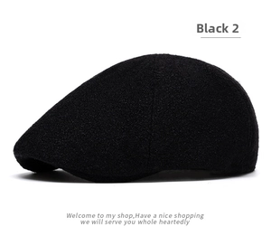 Close-up of black wool blend beret hat showing high-quality textured fabric details