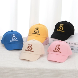 Collection of colorful cotton baseball caps with embroidered cartoon bears for kids
