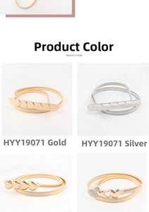 Detailed view of elastic metal waist belts in gold and silver with various heart buckles