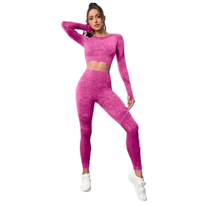 Seamless magenta yoga set featuring long sleeve thumb hole top and high waist leggings