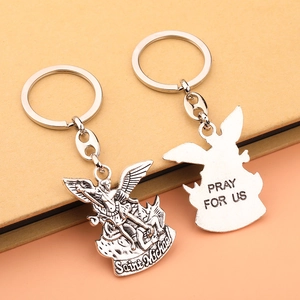 Saint Michael silver metal keychain set featuring engraved religious pendant details