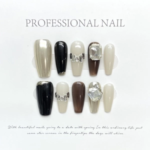 Handmade press-on nails set featuring rhinestones and chrome finish in elegant neutral tones