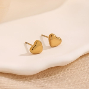 Polished golden heart stud earrings in titanium steel for a minimalist aesthetic