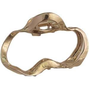 Minimalist gold irregular wave metal claw clip with liquid geometric design for hair