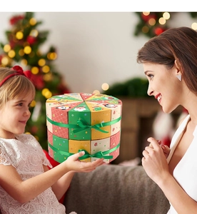 Christmas countdown gift boxes arranged as cake with Santa and reindeer illustrations