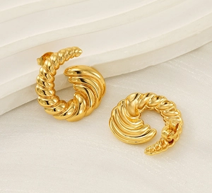 Detailed view of 18k gold plated titanium steel screw twist croissant stud earrings