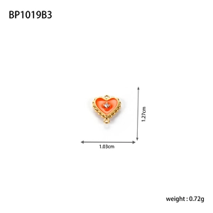 Orange heart enamel pendant with gold beaded edge and rhinestone, size 1.03cm by 1.27cm